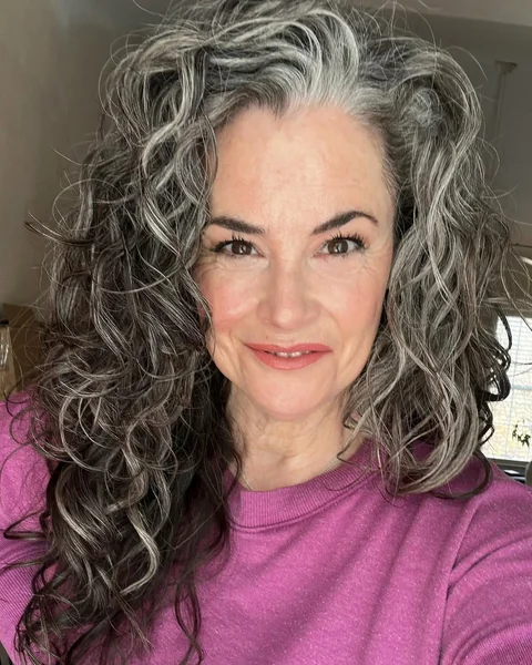 Long Voluminous Gray Blended Curls and Waves