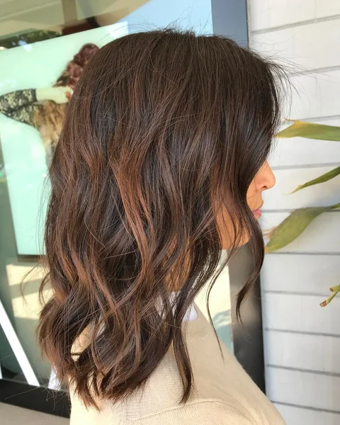 Mid-Length Brunette Waves with Caramel Highlights