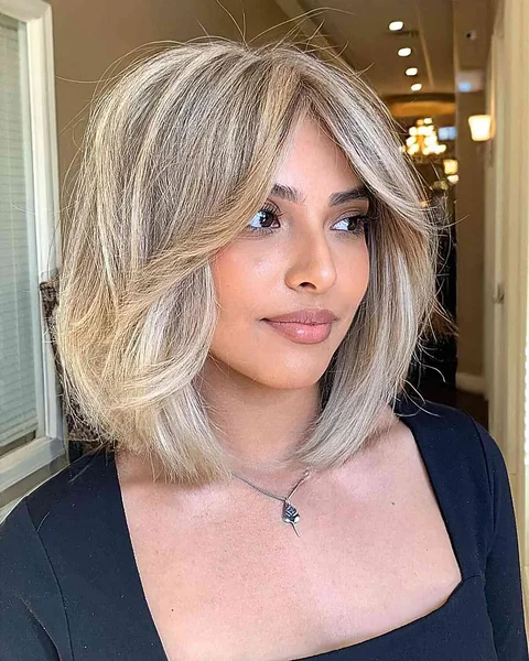 Modern Blonde Bob with Soft Face-Framing Curtain Bangs