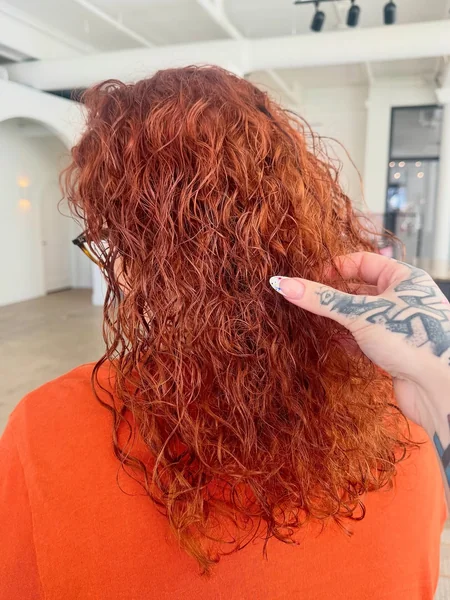Rich Copper Shoulder-Length Curls with Texture