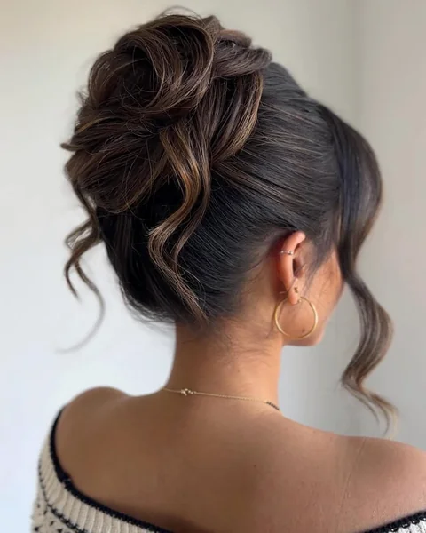 Romantic Low Bun Updo with Face-Framing Waves