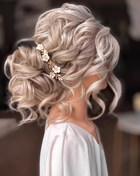 Romantic Platinum Updo with Soft Curls and Accessories