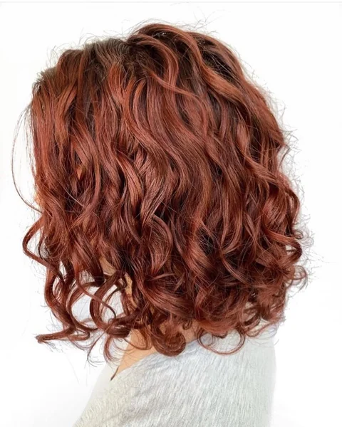 Shoulder-Length Layered Bob for Defined Copper Waves
