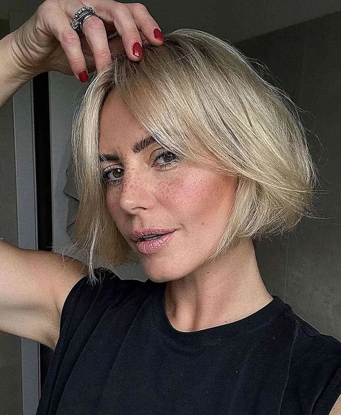 Sleek Chin-Length Bob with Soft Curtain Bangs