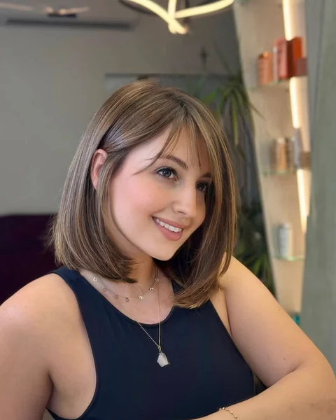 Sleek Layered Bob with Long Side-Swept Bangs