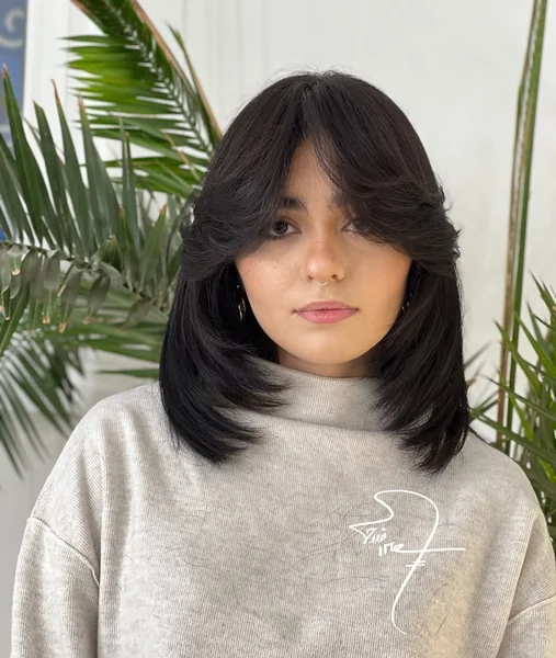 Sleek Mid-Length Blowout with Curtain Bangs