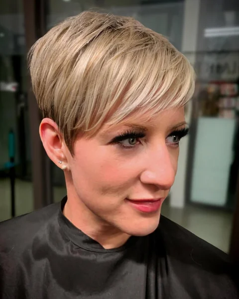 Sleek Platinum Pixie with Long Sweeping Bangs
