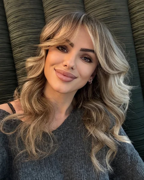 Soft Blonde Curls with Curtain Bangs