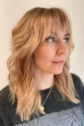 Soft Peachy Blonde Shag with Blunt Bangs