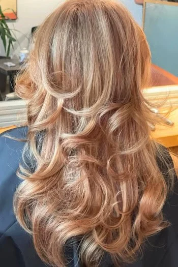 Soft Rose Gold Layers with Bouncy Curls