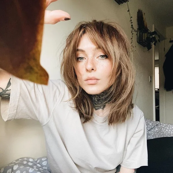 Sun-Kissed Tousled Lob with Feathered Layers