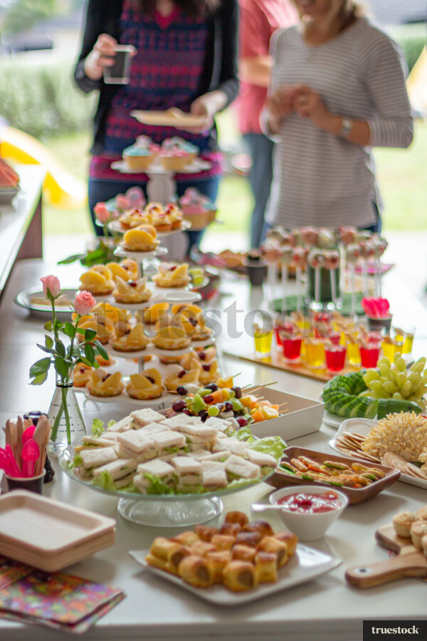 Table of finger food for a child's party by Fraser Tebbutt - Truestock