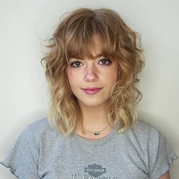 Textured Wavy Blonde Shag with Full Fringe