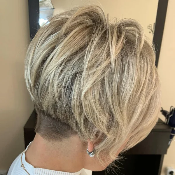 Voluminous Blonde Pixie with Textured Long Layers