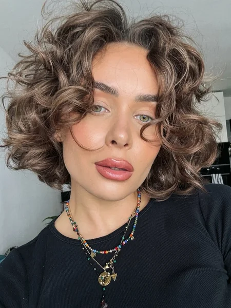 Voluminous Curly Bob with Soft Curtain Bangs