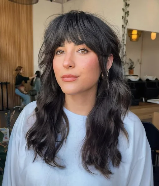Voluminous Dark Wavy Shag with Full Fringe