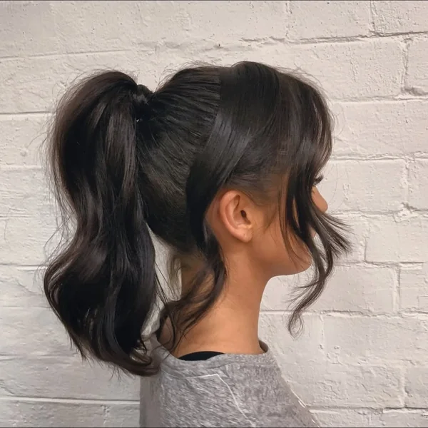 Voluminous High Ponytail with Soft Fringe