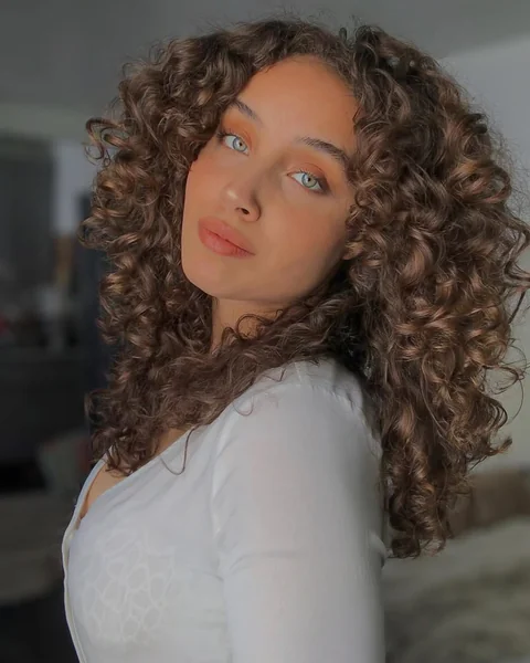 Voluminous Shoulder-Length Ringlets in Warm Caramel Brown