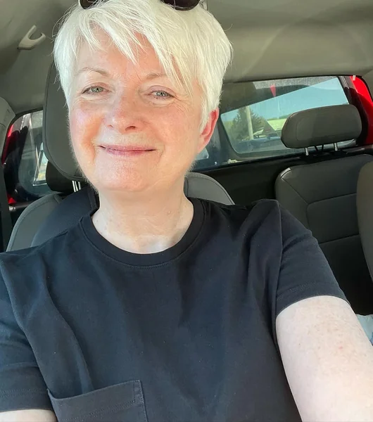 Voluminous Stacked Blonde Pixie with Long Fringe