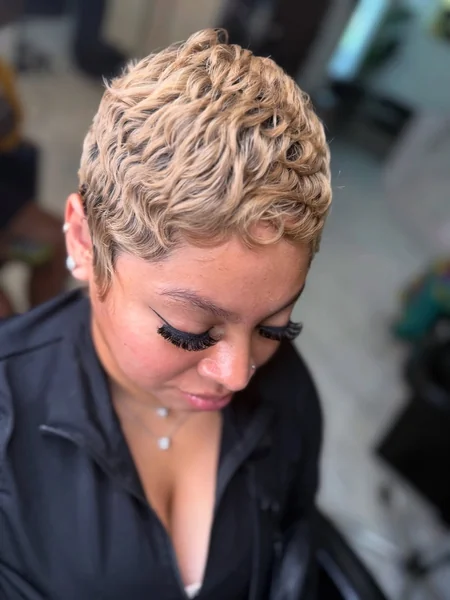 Wavy Blonde Pixie with Tightly Sculpted Texture