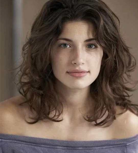 Wavy Mid-Length Cut with Face-Framing Layers