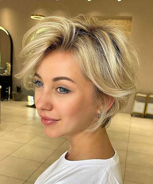 Airy Champagne Blonde Pixie with Voluminous Sweeping Layers
