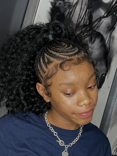 Artistic Swirled Braids with Voluminous Raven Curls