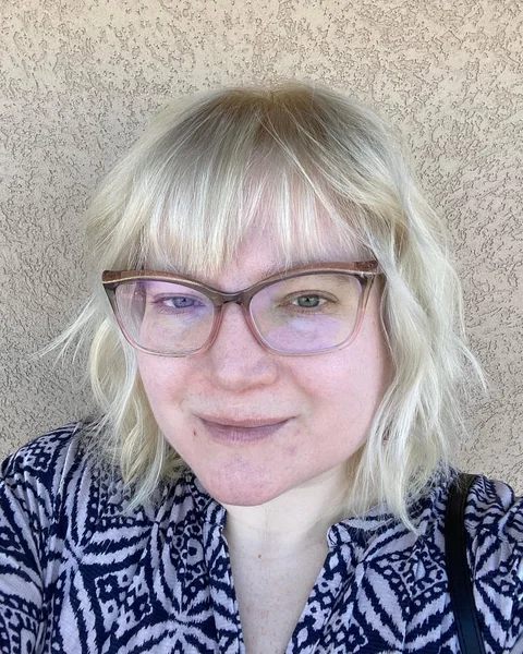 Bright Platinum Shaggy Bob with Wispy Fringe
