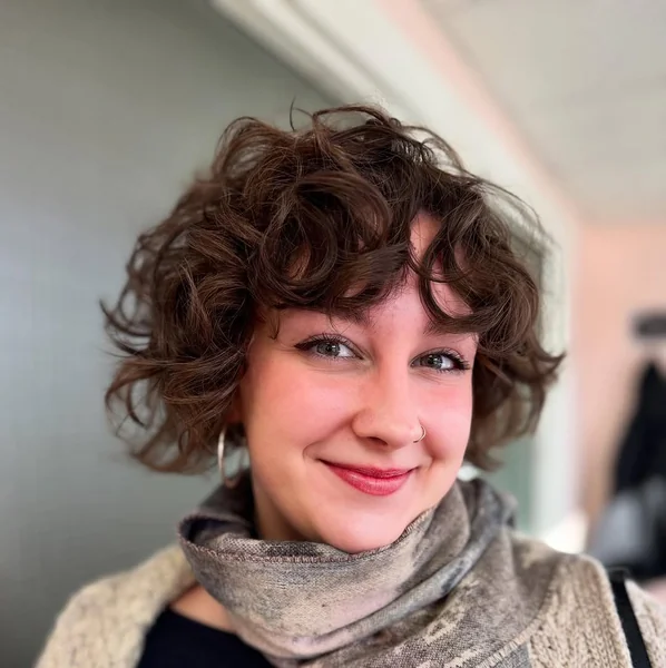 Brunette Curly Bixie with Airy Face-Framing Tendrils