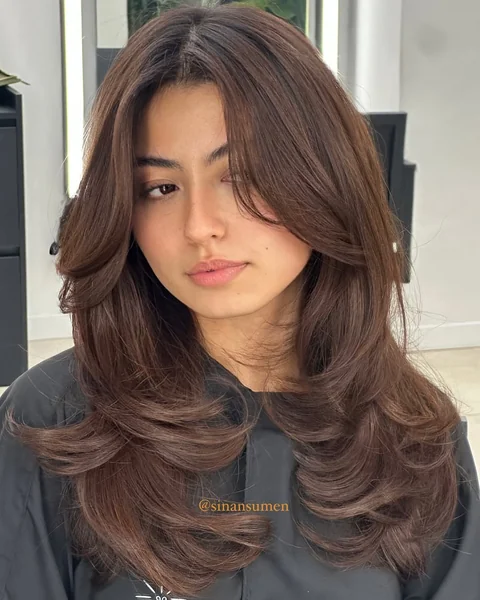 Chic Brunette Shag with Wispy Curtain Bangs