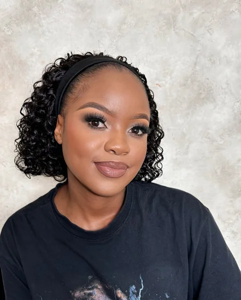 Chic Jet-Black Curly Bob with Headband Detail