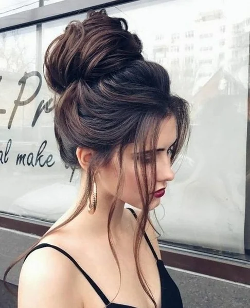 Chic Top Knot with Feathered Curtain Bangs