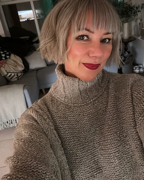 Chin-Length Butterfly Bob with Feathered Silver Texture