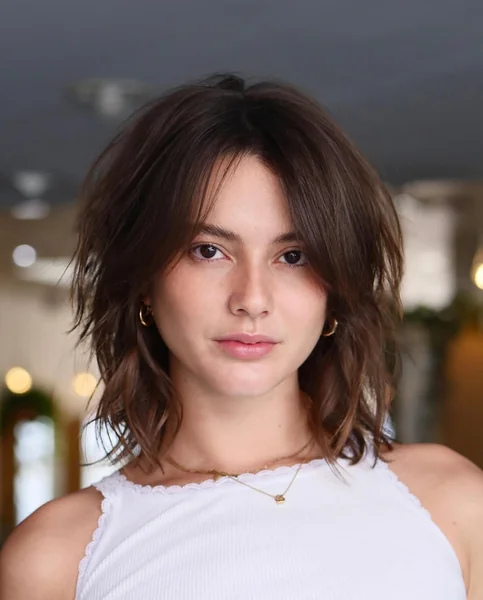 Choppy Brunette Wolf Cut Bob with Curtain Fringe