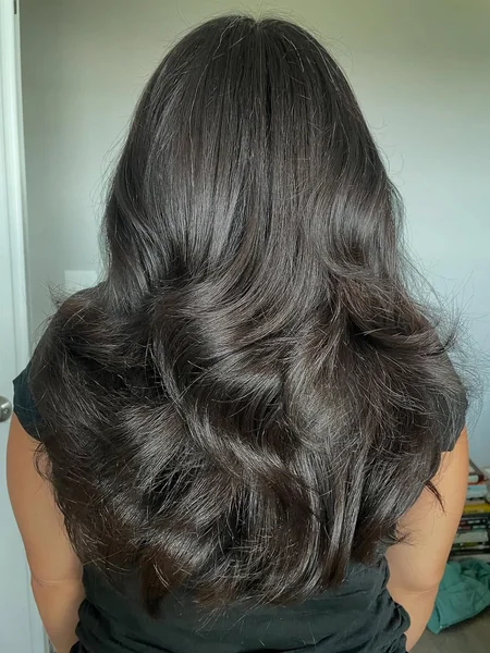 Deep Brunette Butterfly Cut with Voluminous Ends