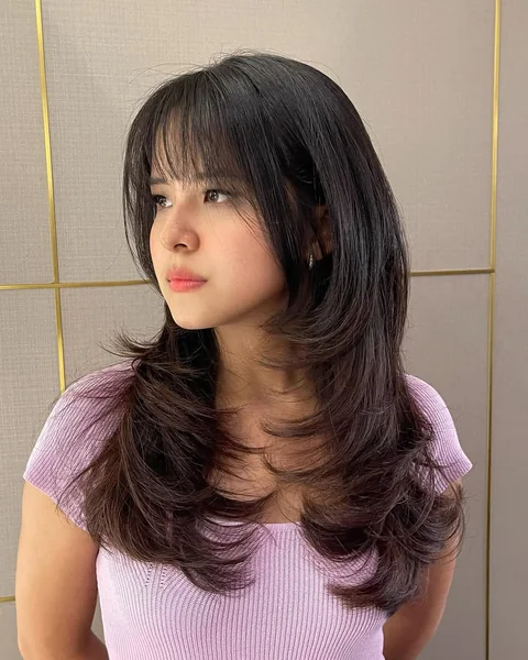 Deep Brunette Layered Butterfly Cut with Full Fringe
