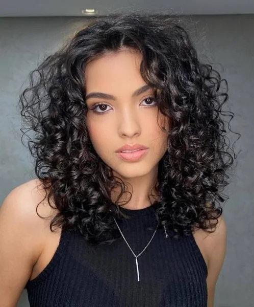 Defined Raven Ringlets with Airy Face-Framing Volume