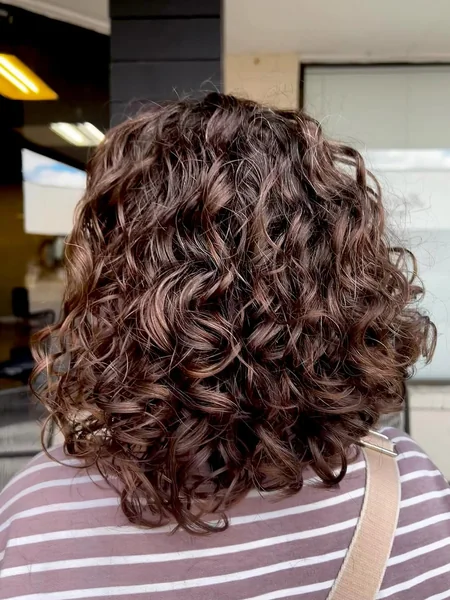 Dimensional Chocolate Curly Bob with Defined Coils
