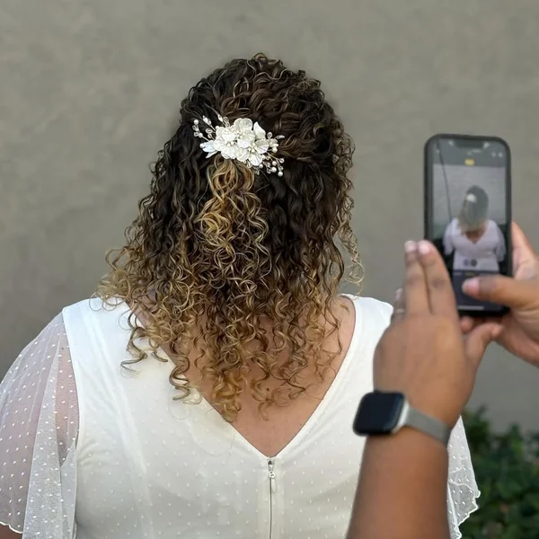 Dimensional Golden Curly Bob with Swept Fringe
