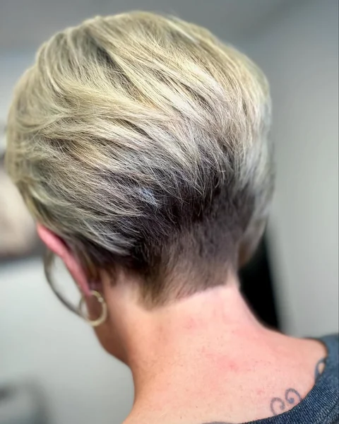 Edgy Blonde Stacked Bob with Tapered Shadow Nape