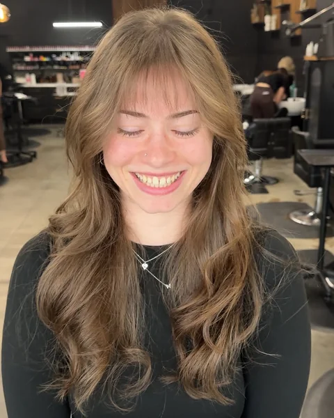 Effortless Ash Blonde Butterfly Layers with Airy Fringe