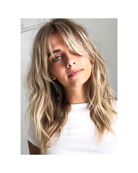 Effortless Sun-Kissed Shag with Wispy Curtain Bangs
