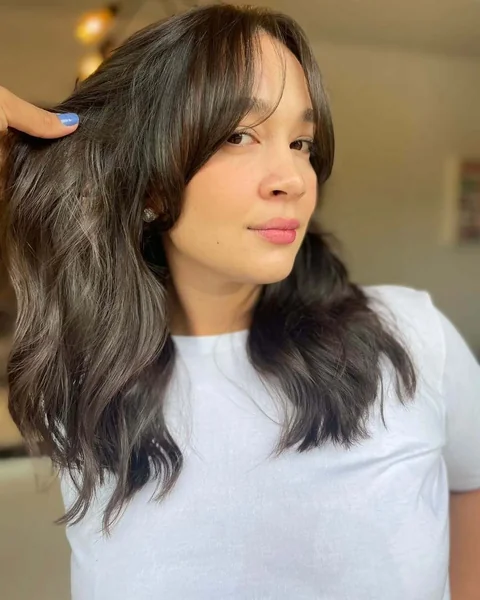 Effortlessly Chic Waves with Long Sweeping Bangs
