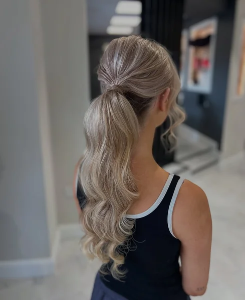 Elegant Mid-Height Ponytail with Hollywood Waves and Volume