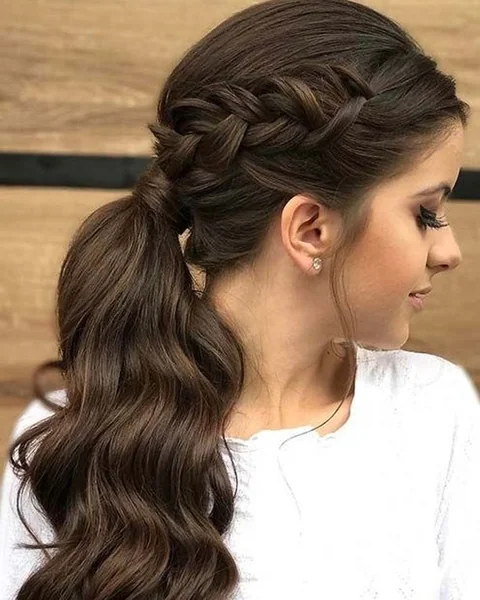 Elegant Braided Ponytail with Voluminous Waves
