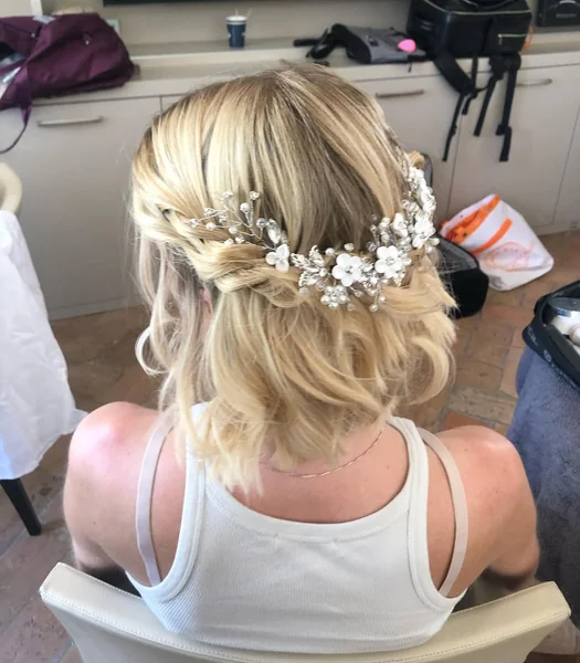 Ethereal Blonde Half-Up Twist with Floral Vine