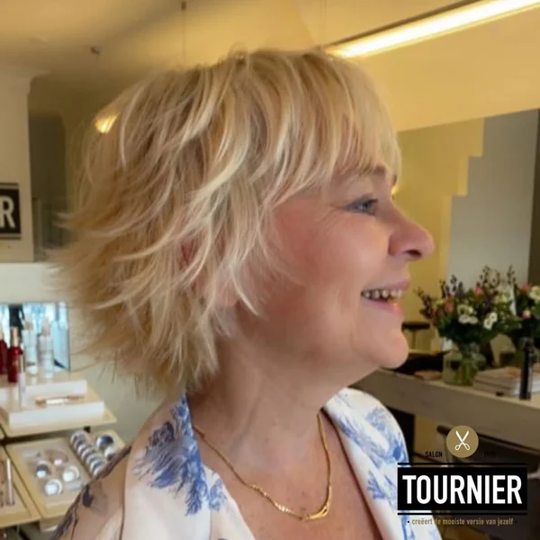 Feathered Honey Blonde Shaggy Bob with Bangs