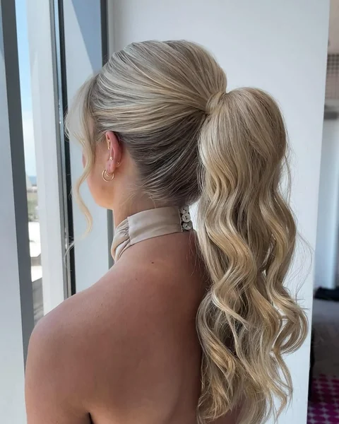 Glamorous Ash Blonde Voluminous Ponytail with Romantic Waves