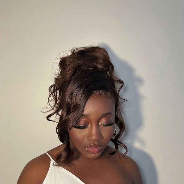 Glamorous High Top Knot with Dramatic Side Swoop