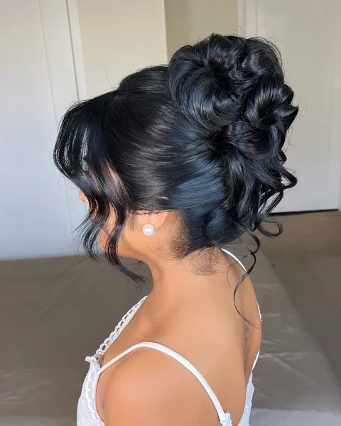 Glamorous Midnight Black Updo with Intricate Swirled Texture
